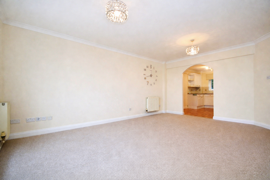 Lot: 73 - TWO-BEDROOM SEAFRONT FLAT WITH PARKING - Living Room looking towards the kitchen